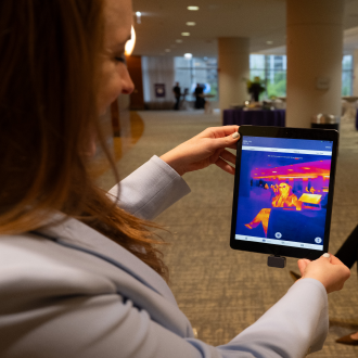 woman viewing thermal imaging technology on a tablet